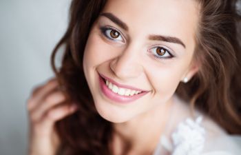 Cheerful broadly young smiling woman.